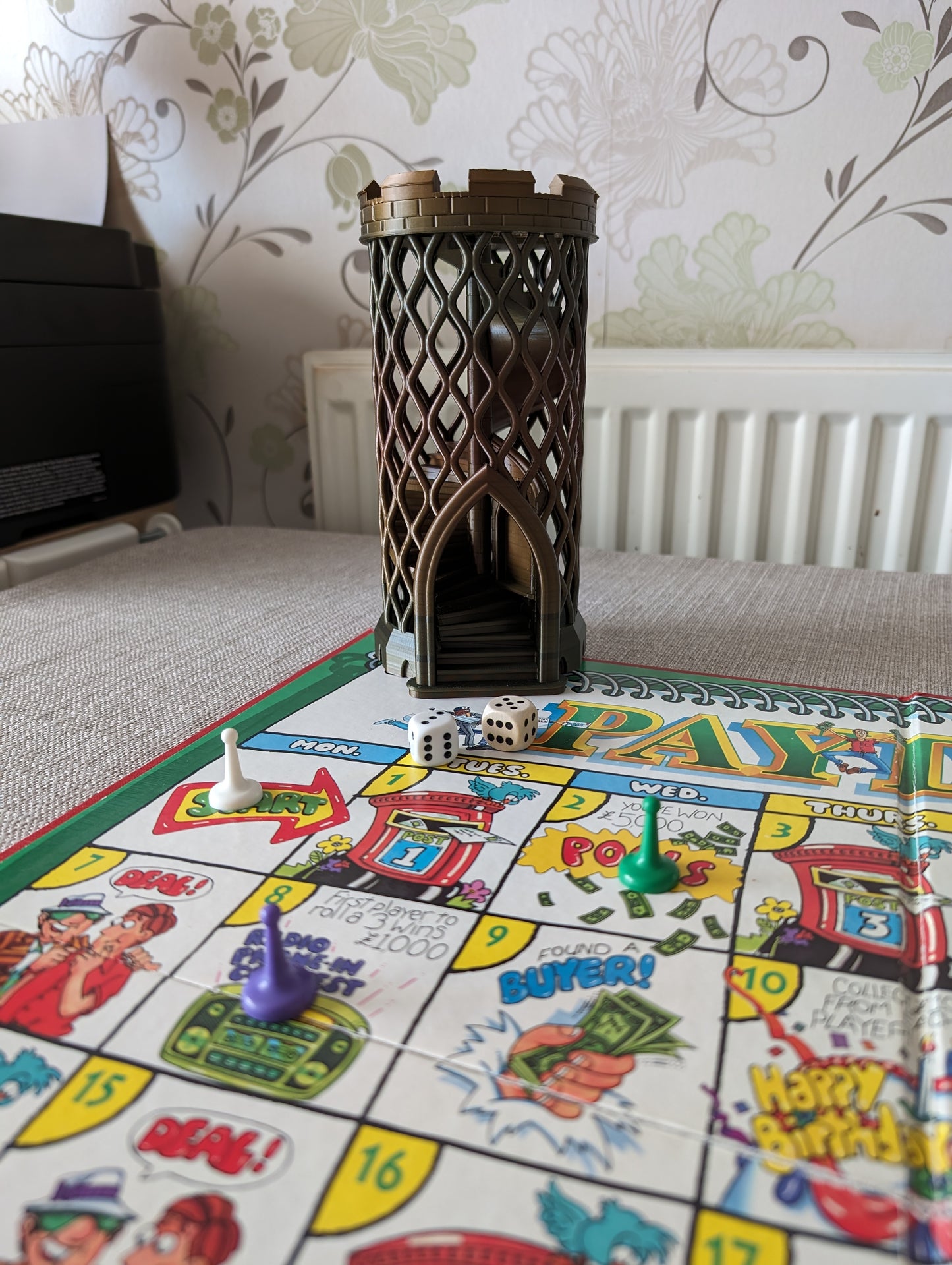 Castle turret dice tower without dice catcher next to board game wide angle