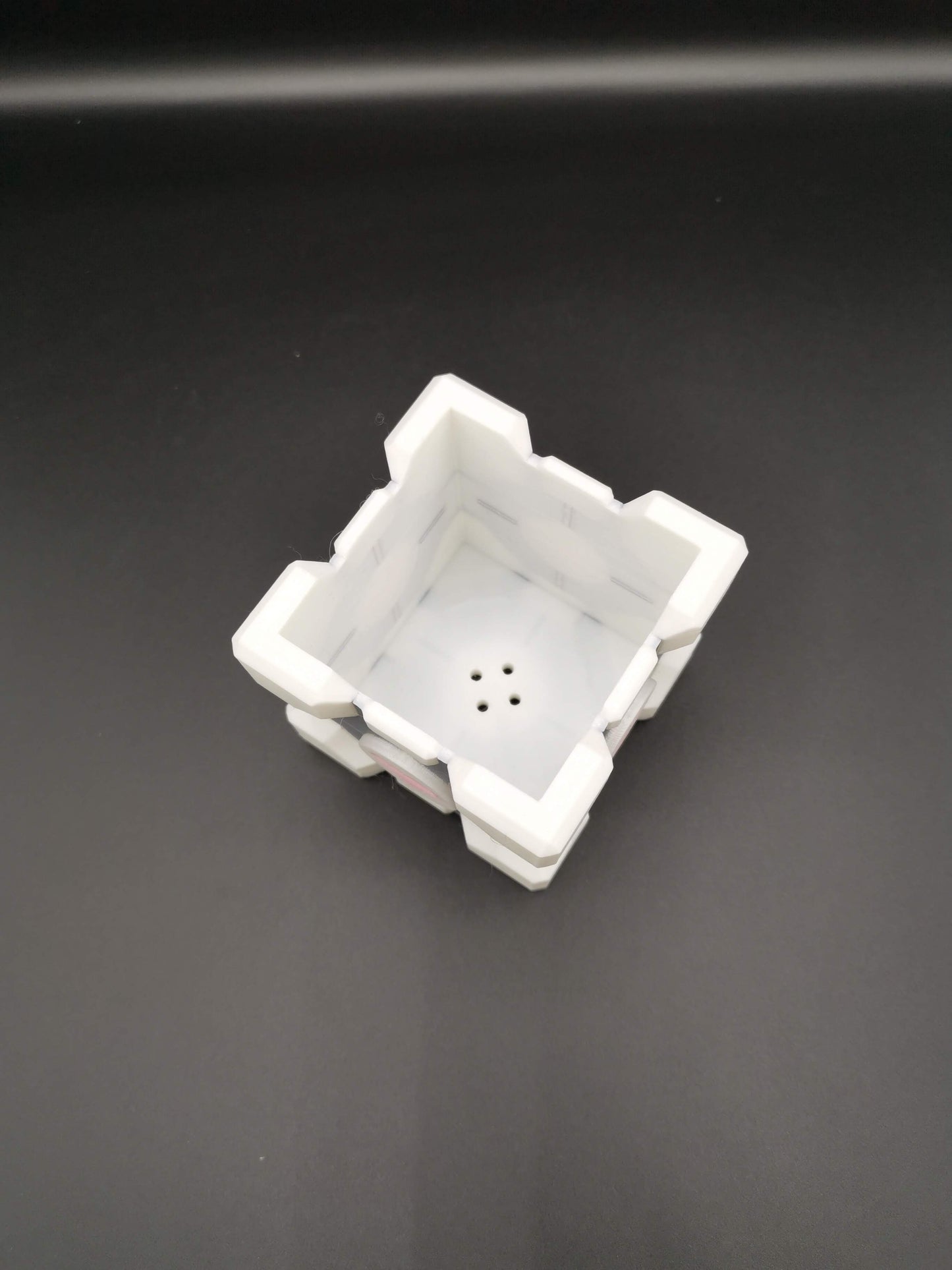 Companion Cube Portal planter close up drainage holes