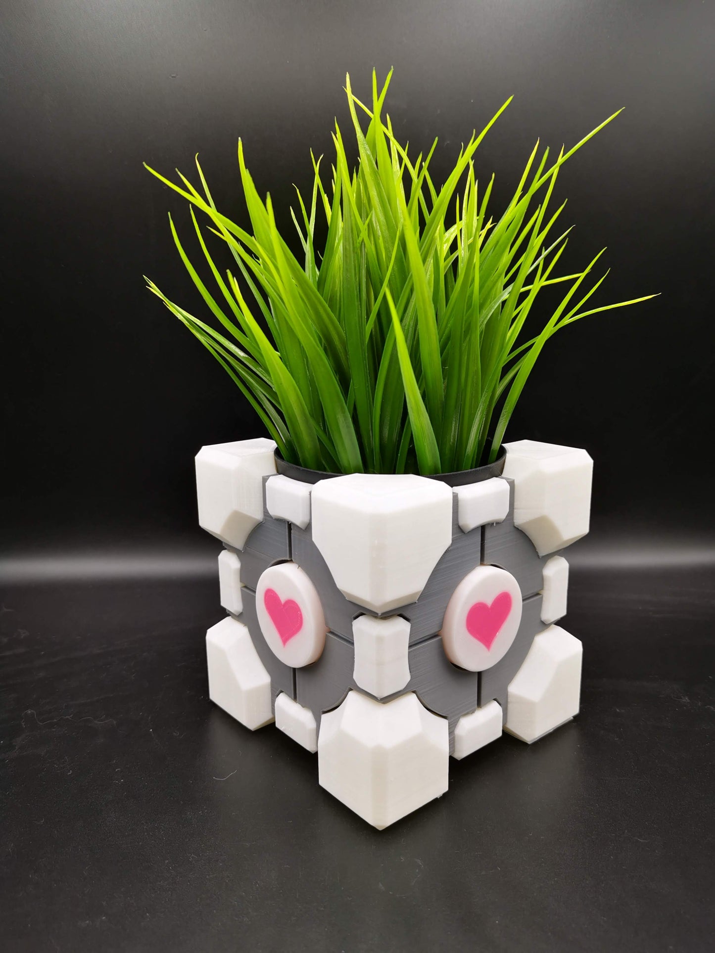 Companion Cube Portal planter with plant from angle