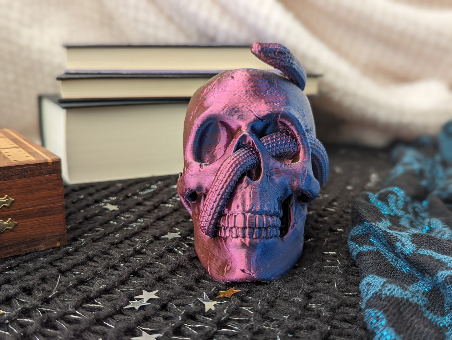 Skull ornament with entwined snake from the front