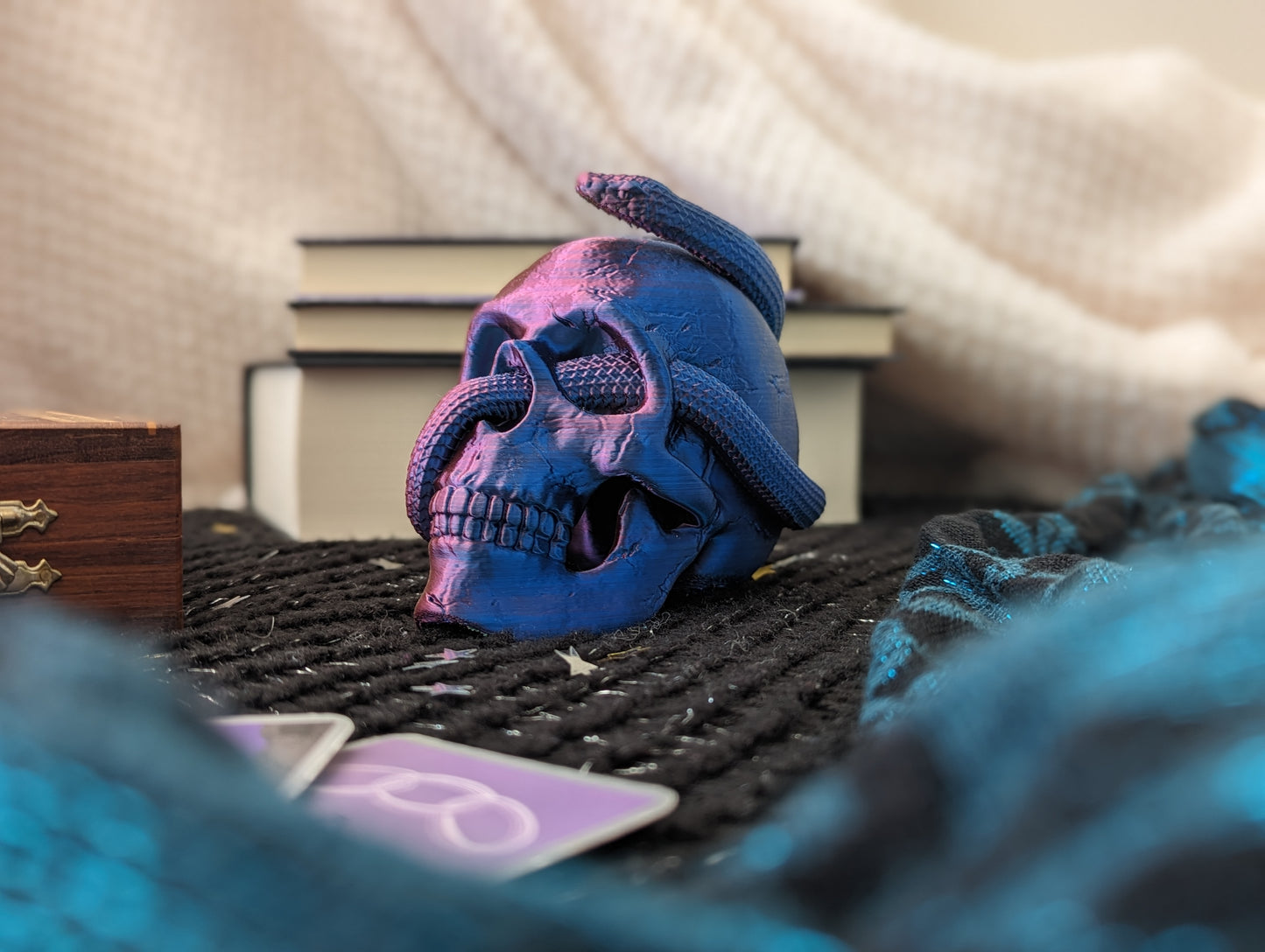 Skull ornament with entwined snake in pink and blue 2-tone