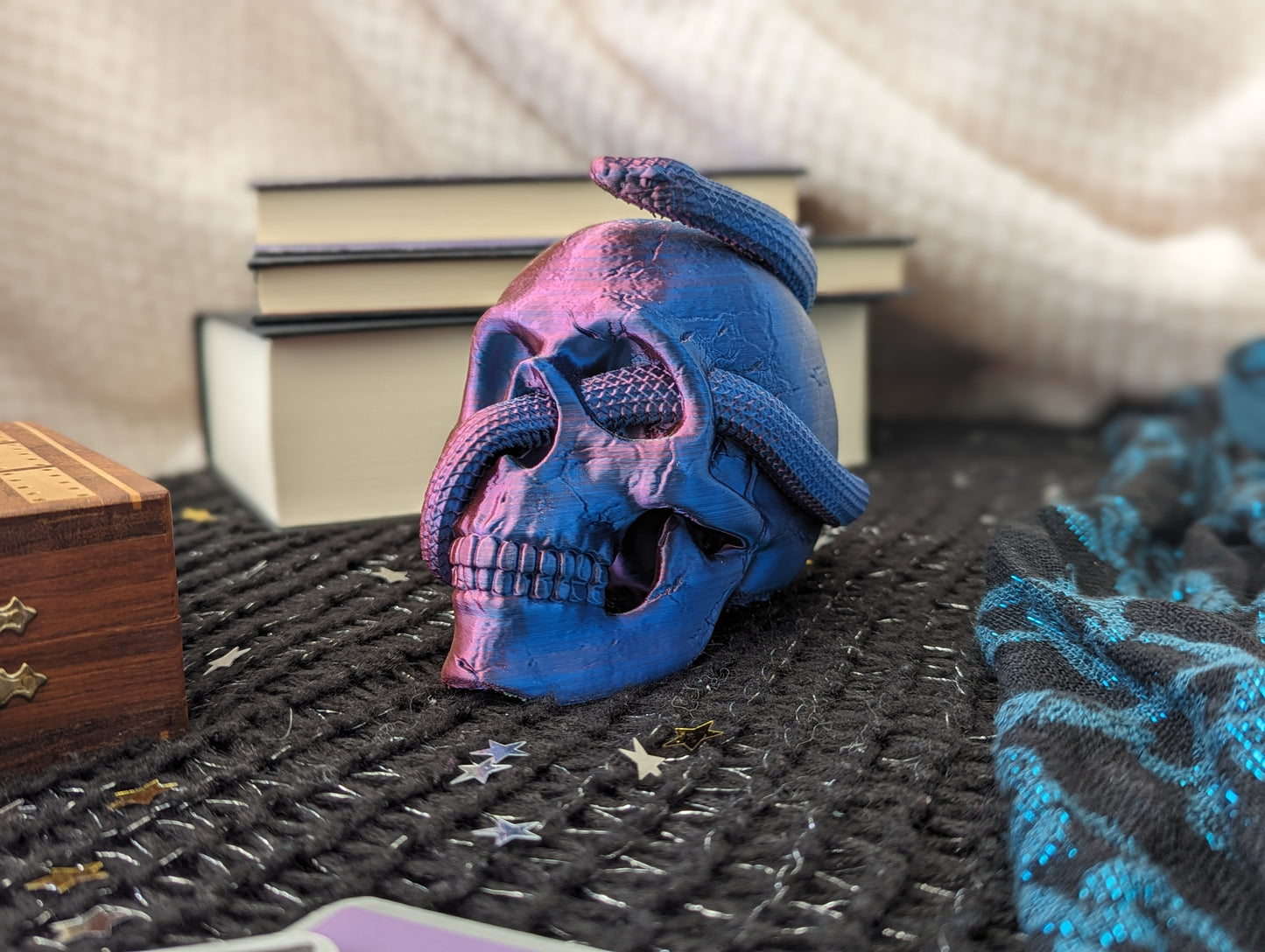 Skull ornament with entwined snake in pink and blue 2-tone
