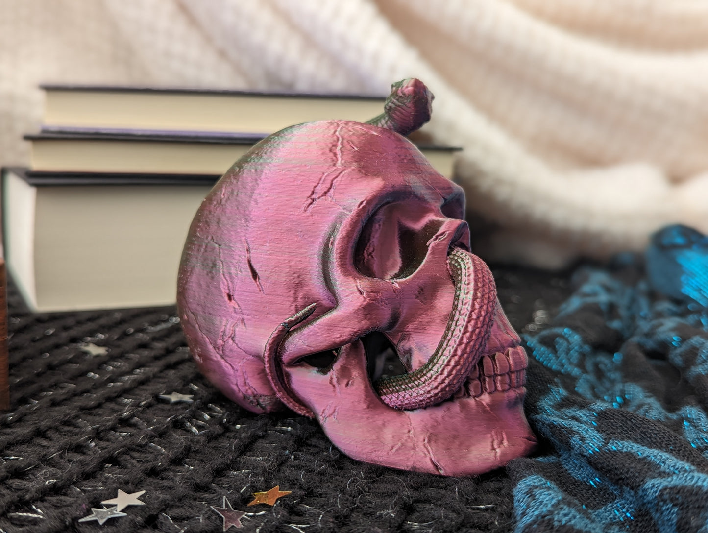 Skull ornament with entwined snake in red and green 2-tone