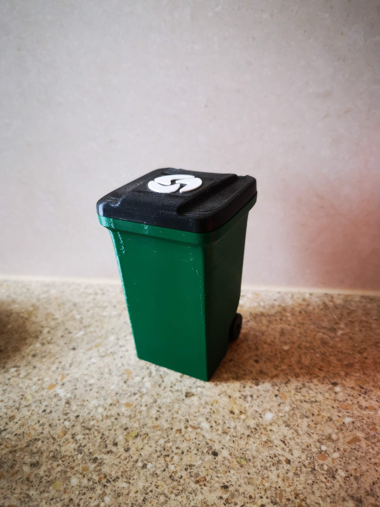 3D printed waste bin trash can from front side angle with lid closed