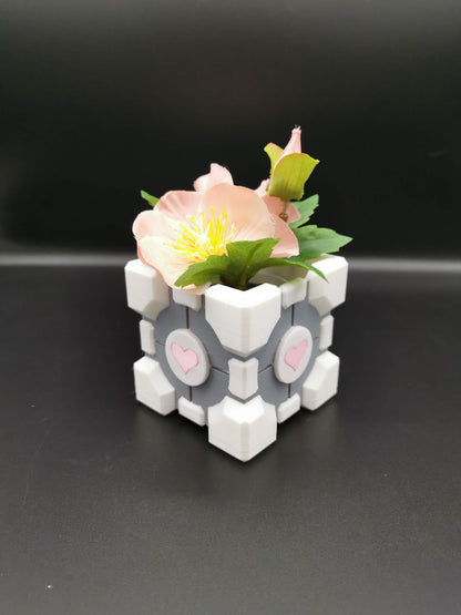 Companion Cube Portal planter close up from front angle with plant