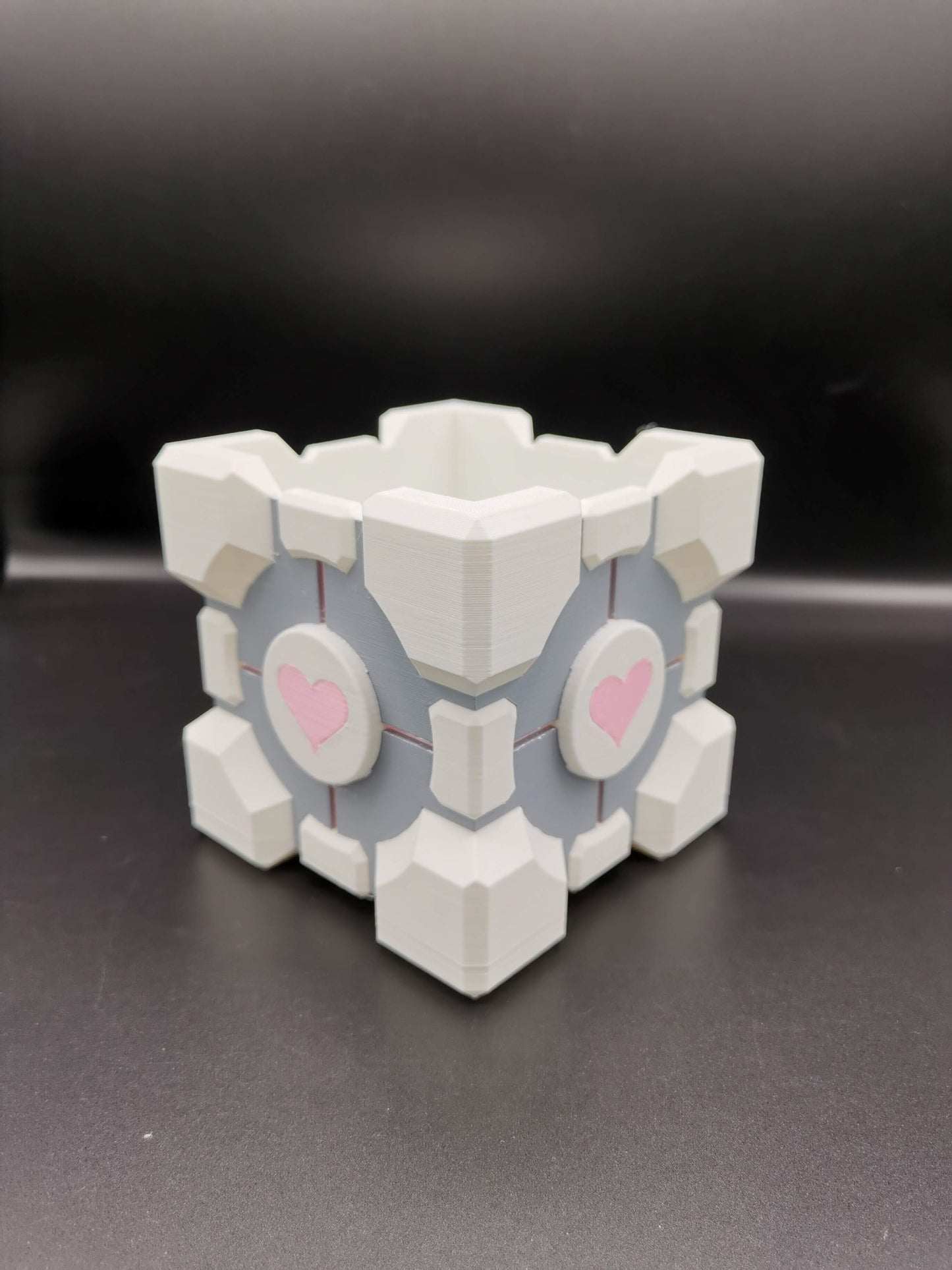 Companion Cube Portal planter from front angle close up without plant
