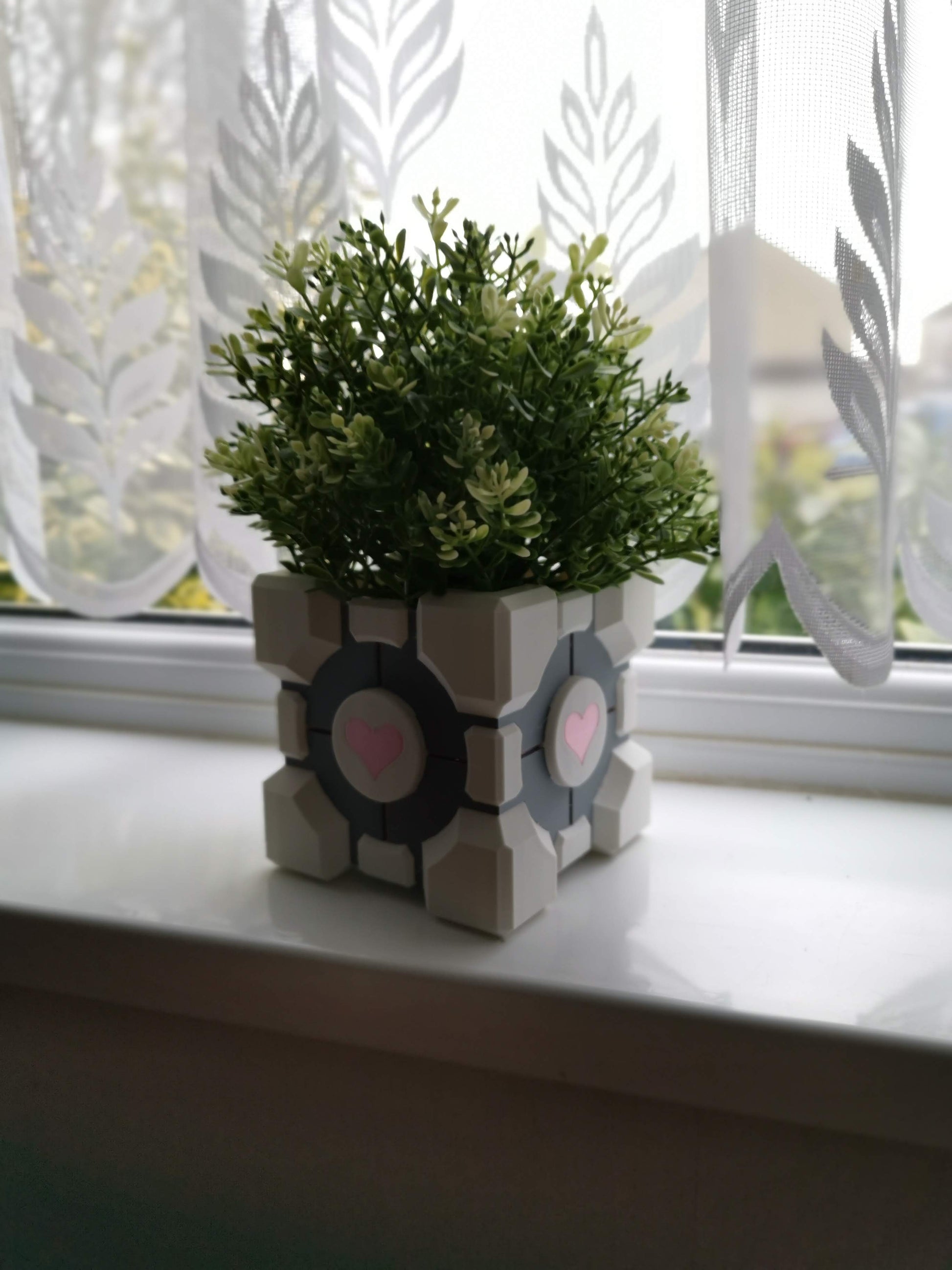Companion Cube Portal planter on windowsill