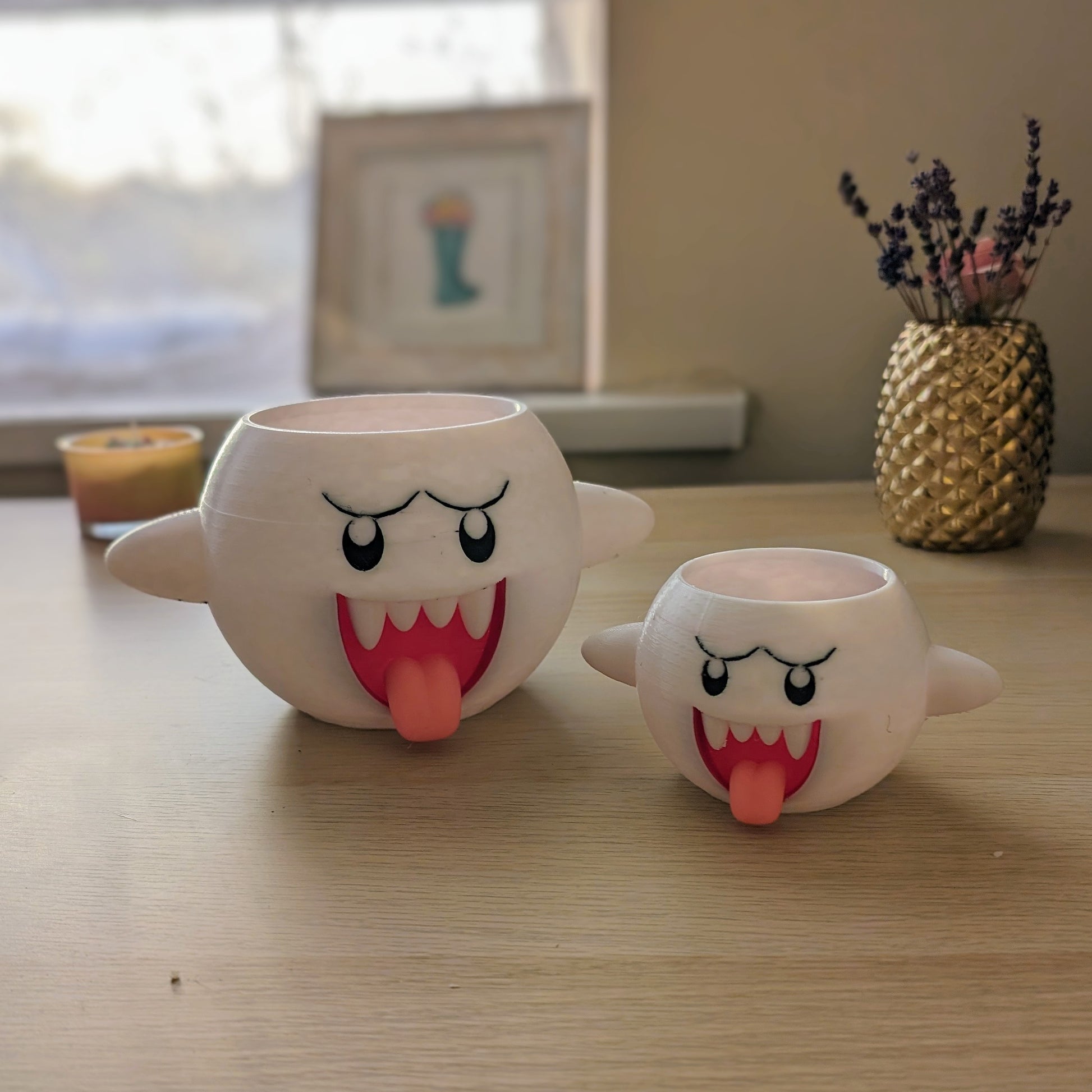 Mario Boo planter in two sizes on desk without plants