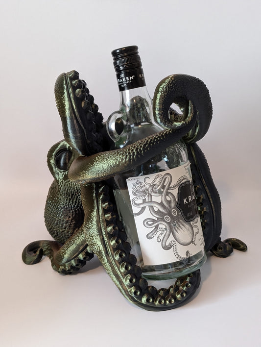 3D printed octopus holding a bottle of Kraken rum with white background