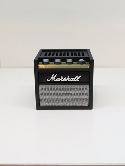 Front of the 3D printed mini guitar amp pick holder on a white shelf