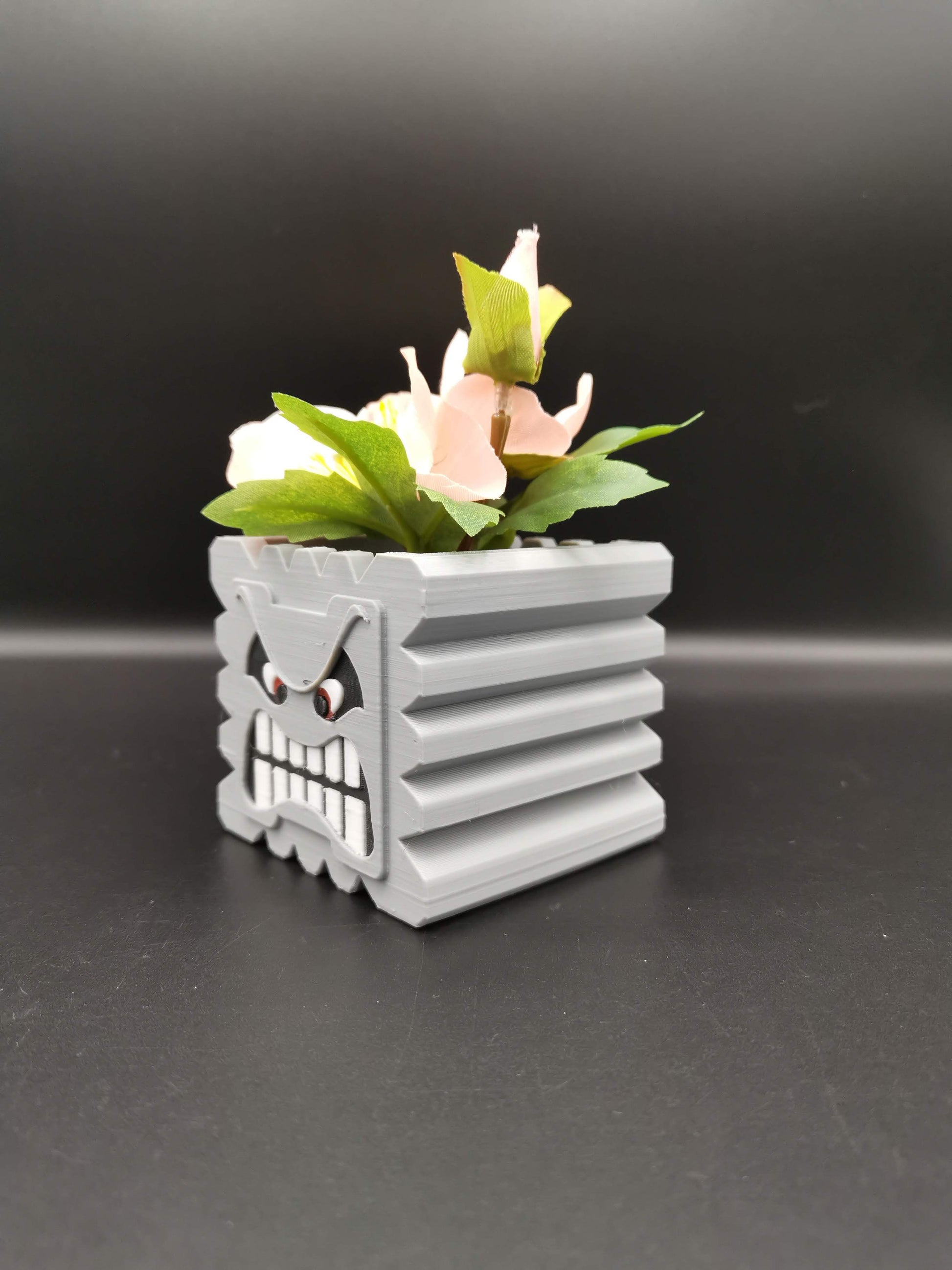 Thwomp Mario planter with plant at an angle