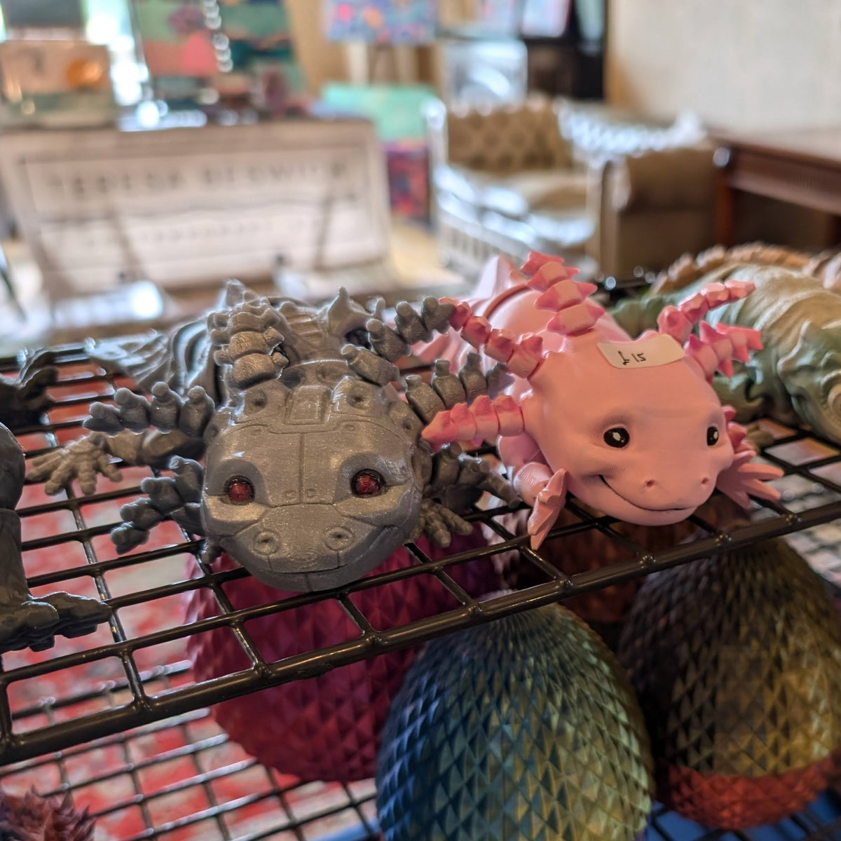 Articulated Axolotl Fidget Toy in pink and white with hand-painted face and gills