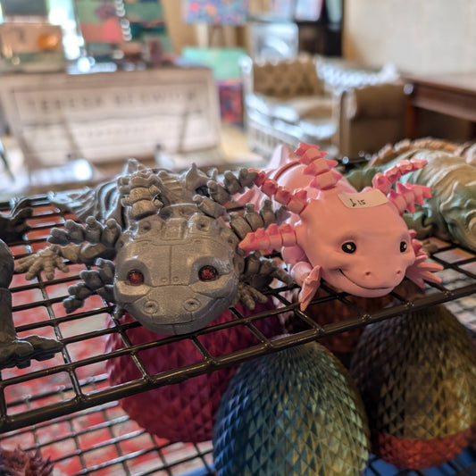 Articulated Axolotl Fidget Toy in pink and white with hand-painted face and gills