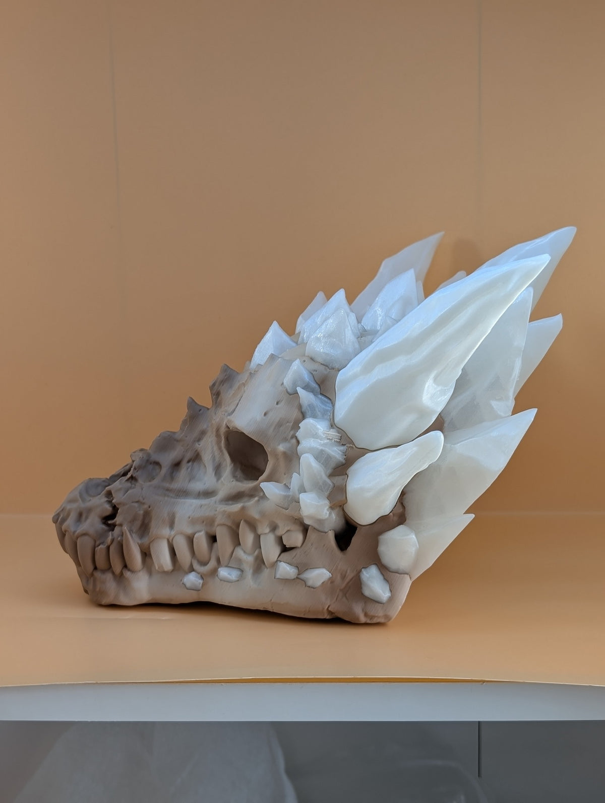 3D printed dragon skull with white crystals, three-quarter view