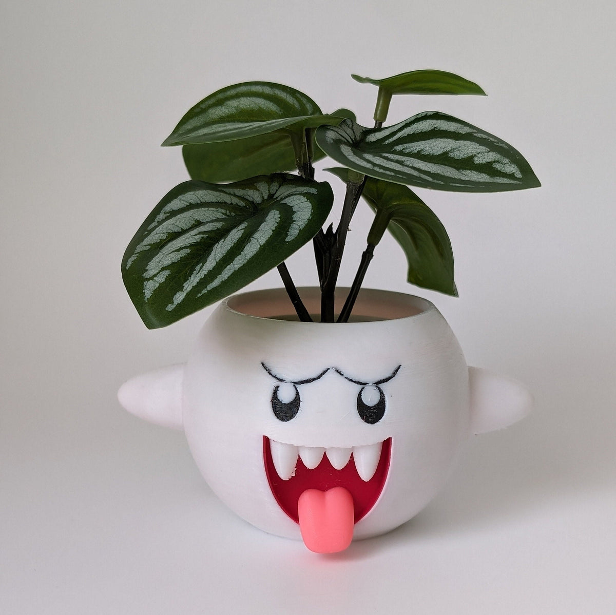 3D printed Mario Boo planter with a leafy plant, front view