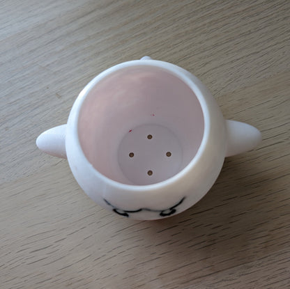 Inside the Boo planter showing the drainage holes