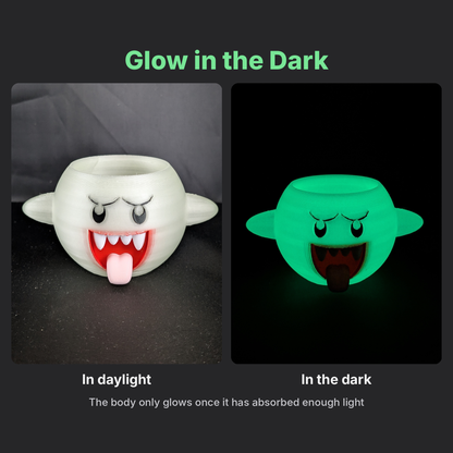 Glow in the dark Boo planter in daylight and glowing green in the dark