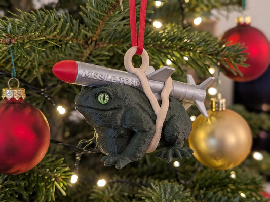 Missile Toad Christmas ornament hanging on a Christmas tree, Full Colour with glass eyes