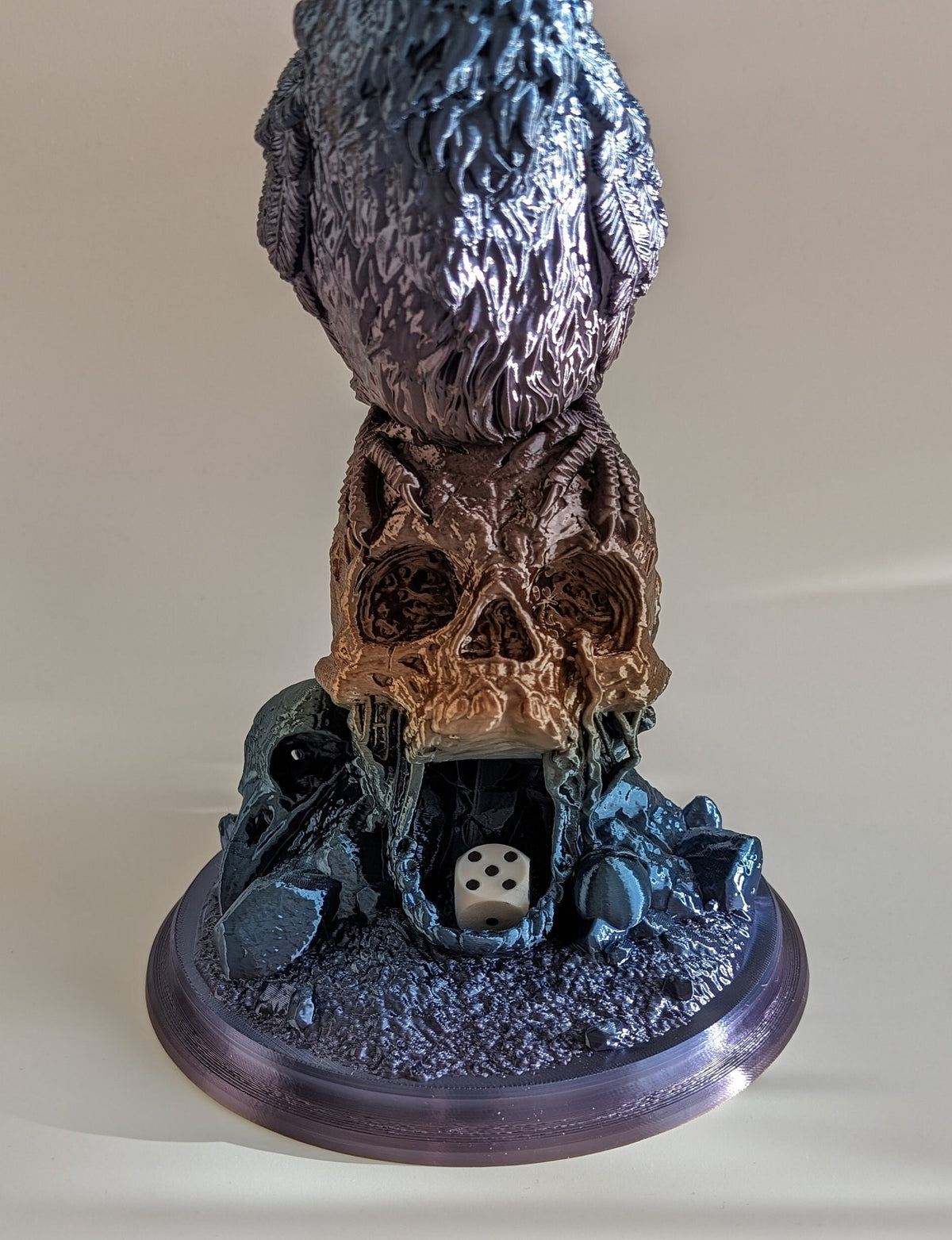 Dice rolled out of the skull's mouth at the base of the tower
