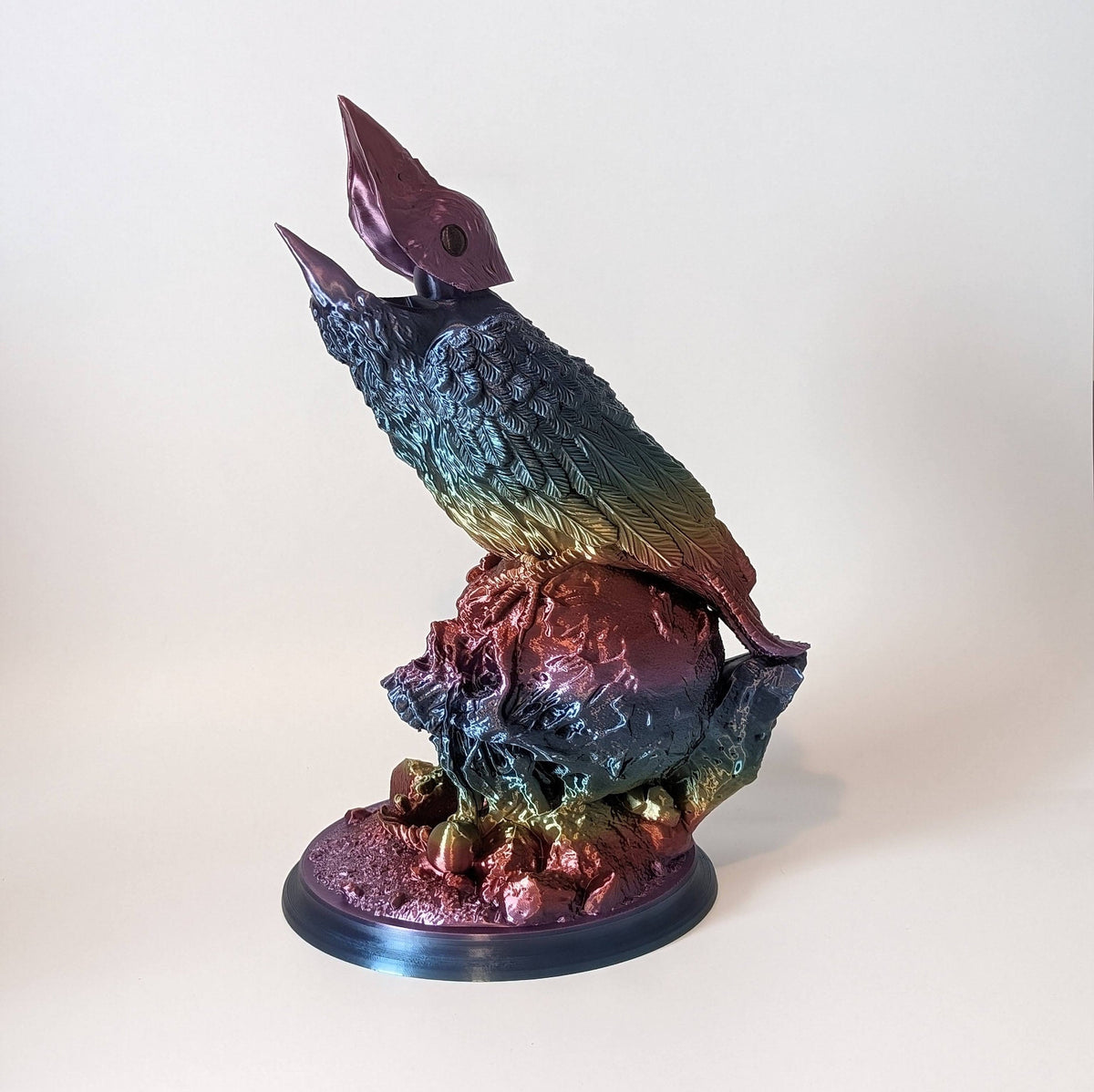 Single colour raven dice tower in rainbow silk with the beak open